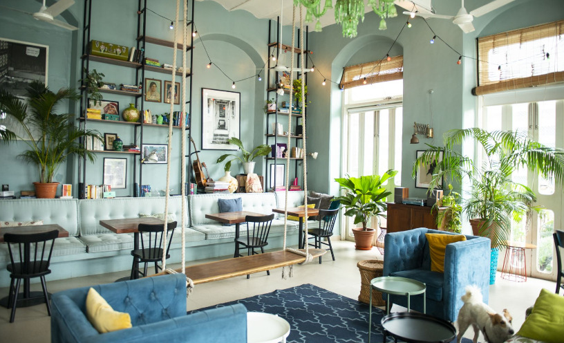 a bright coworking office with lots of green plants
