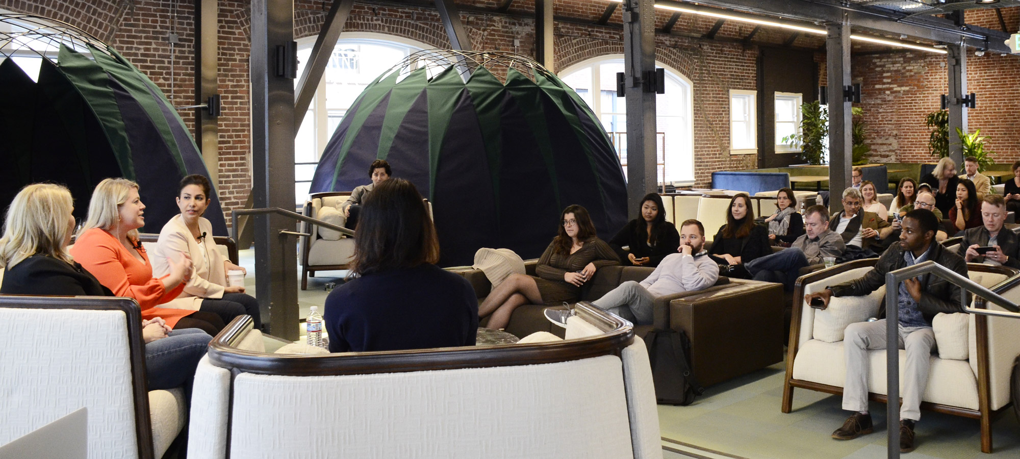 people sitting and talking at a conference