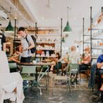 people working from a coffee bar