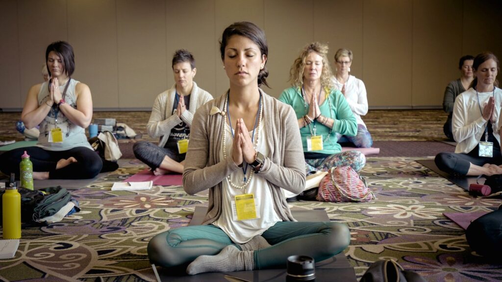 women practicing yoga