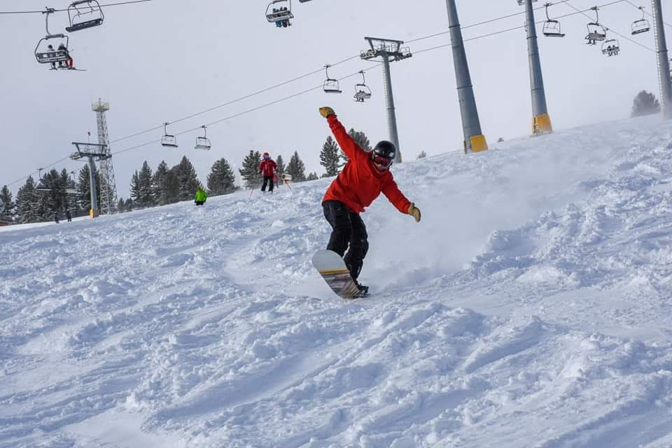 a man snowboarding