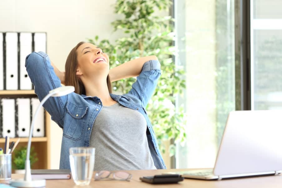 woman happy, relaxing at work