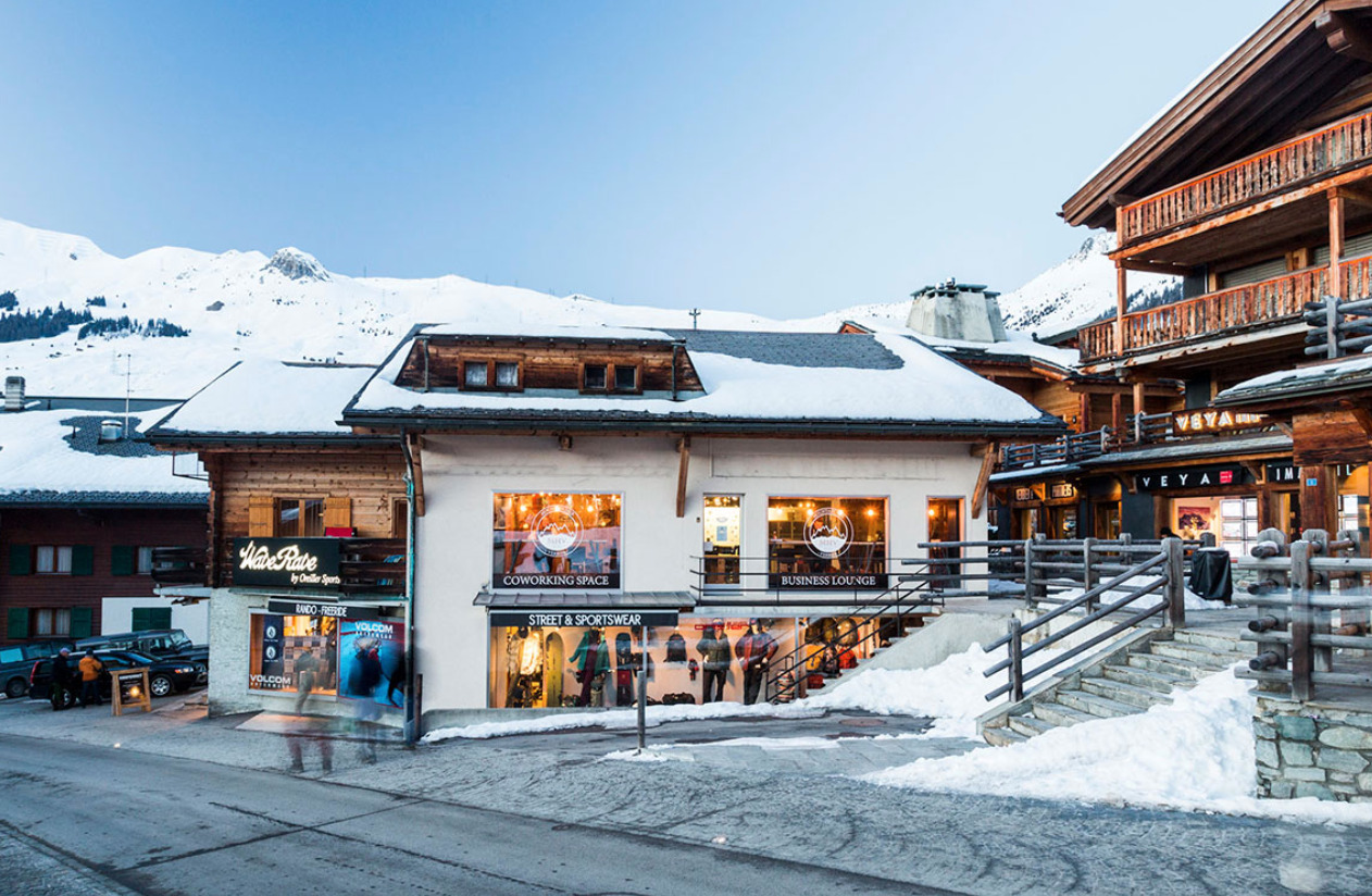 a small town street during winter and snow