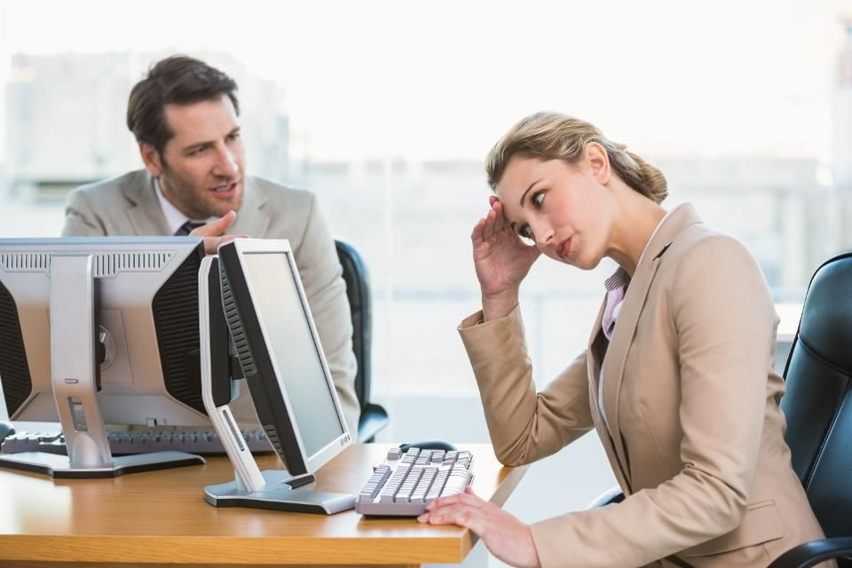 man and woman fighting in coworking office