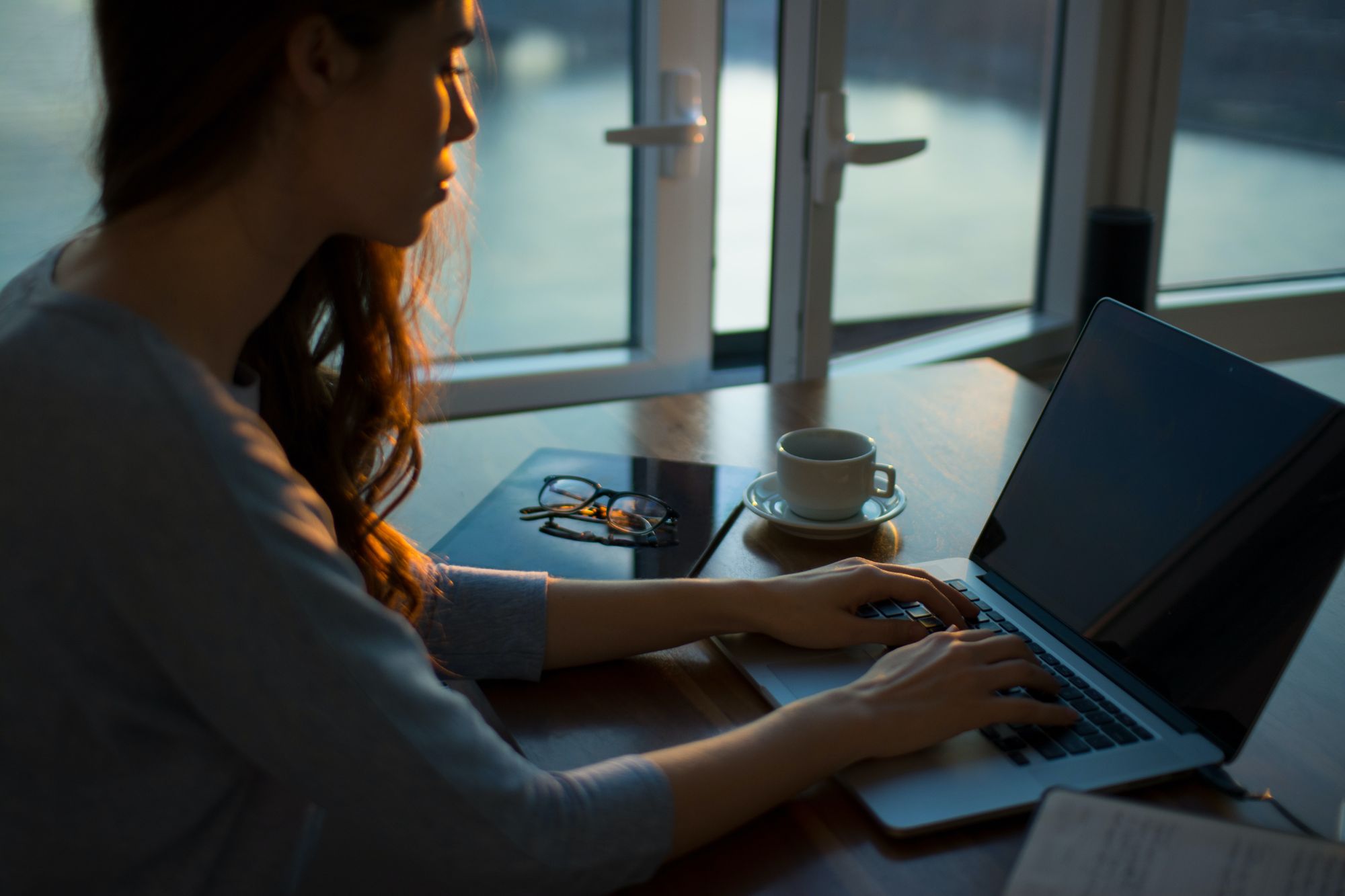 woman typing on laptop