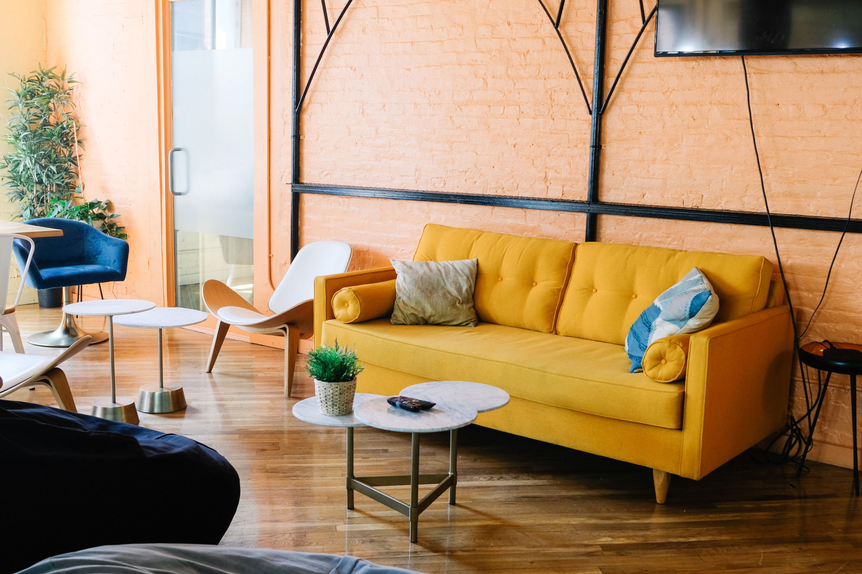 a yellow couch in a coworking office