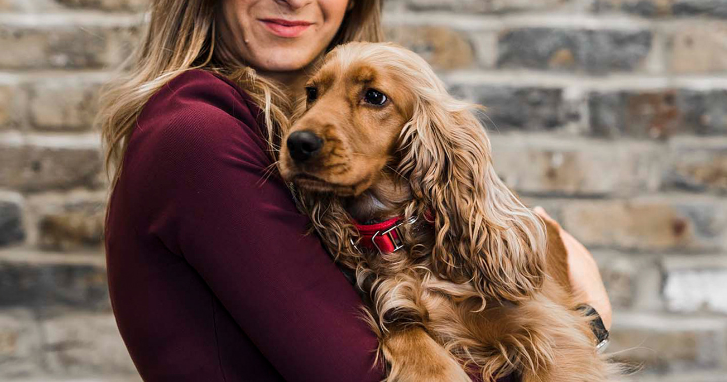 woman hugging a dog