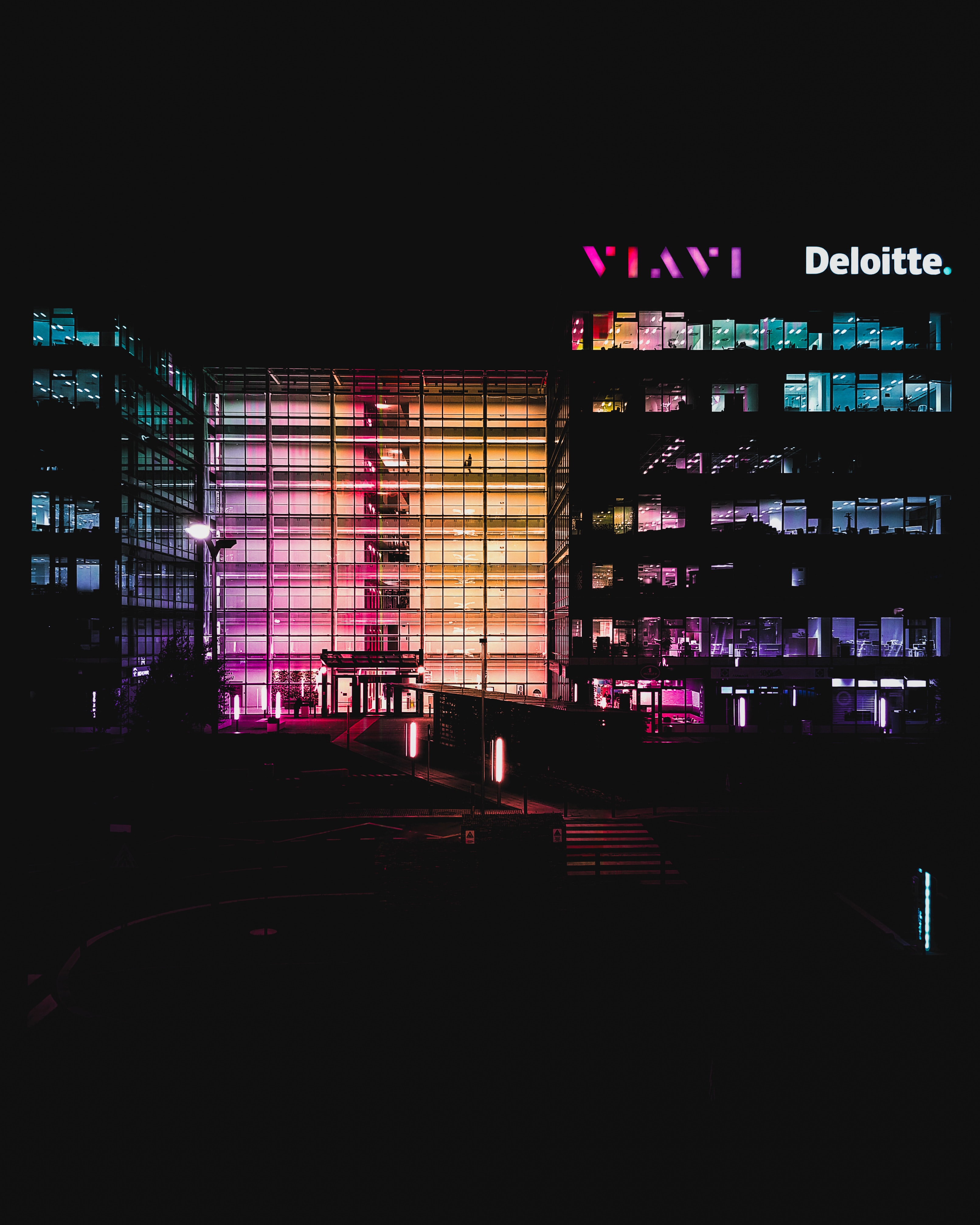 deloitte and vlavi buildings at night