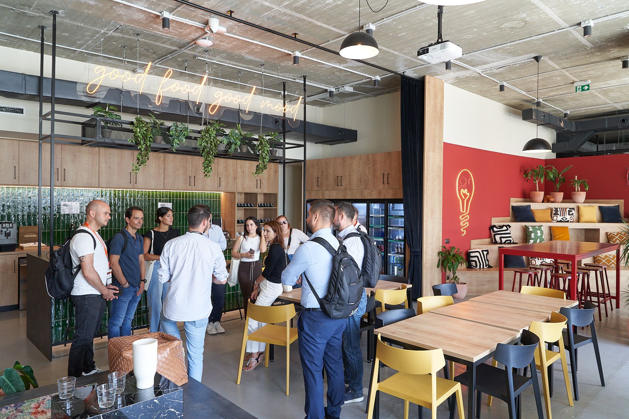 people standing and talking in a coworking place