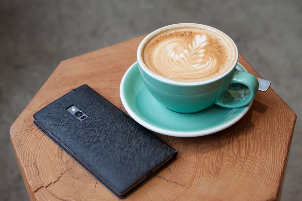 coffee and smartphone on table