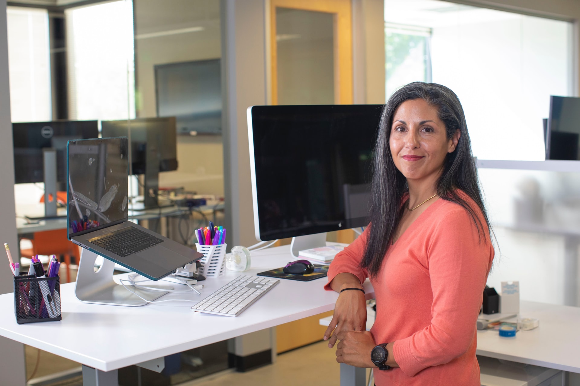 woman working on a standing desk