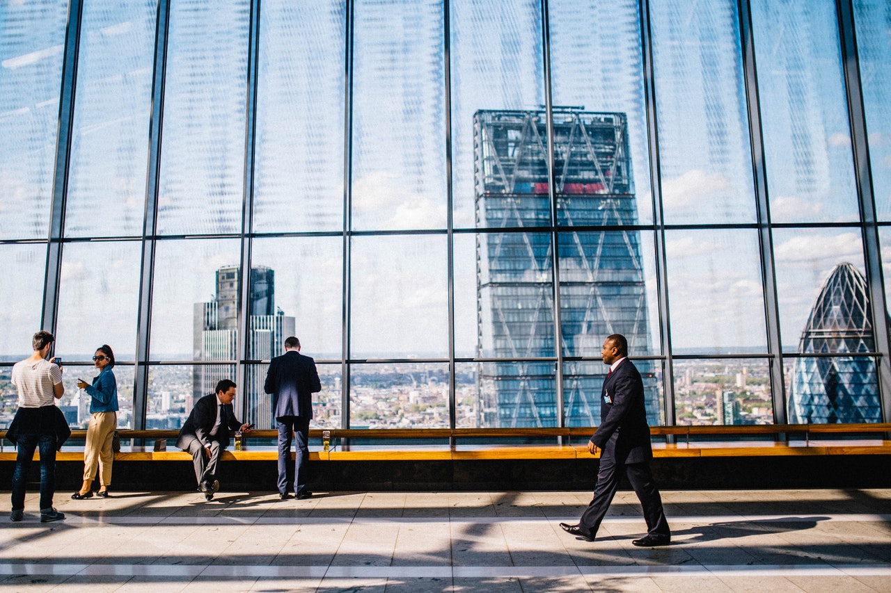 people walking past a building