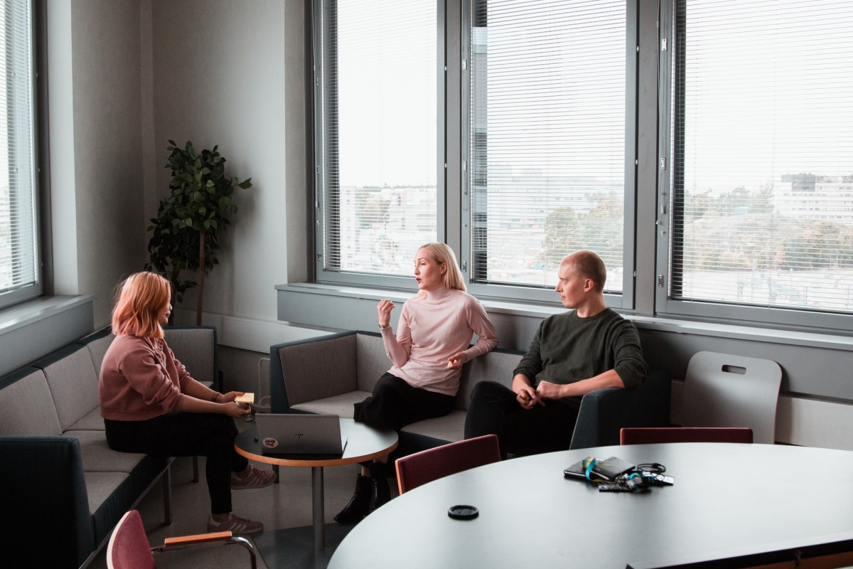 people sitting in an office and talking