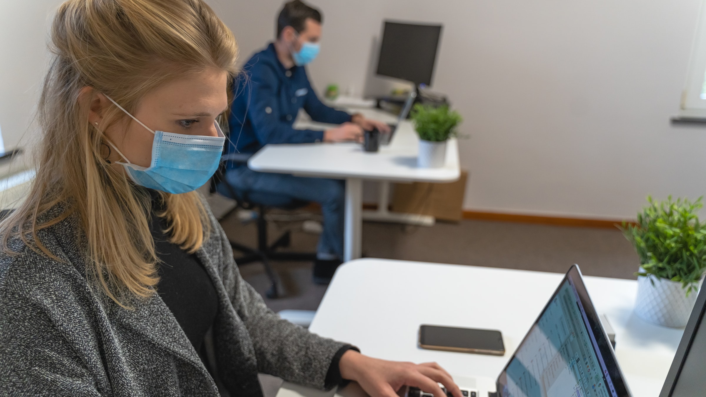 people with masks working in office