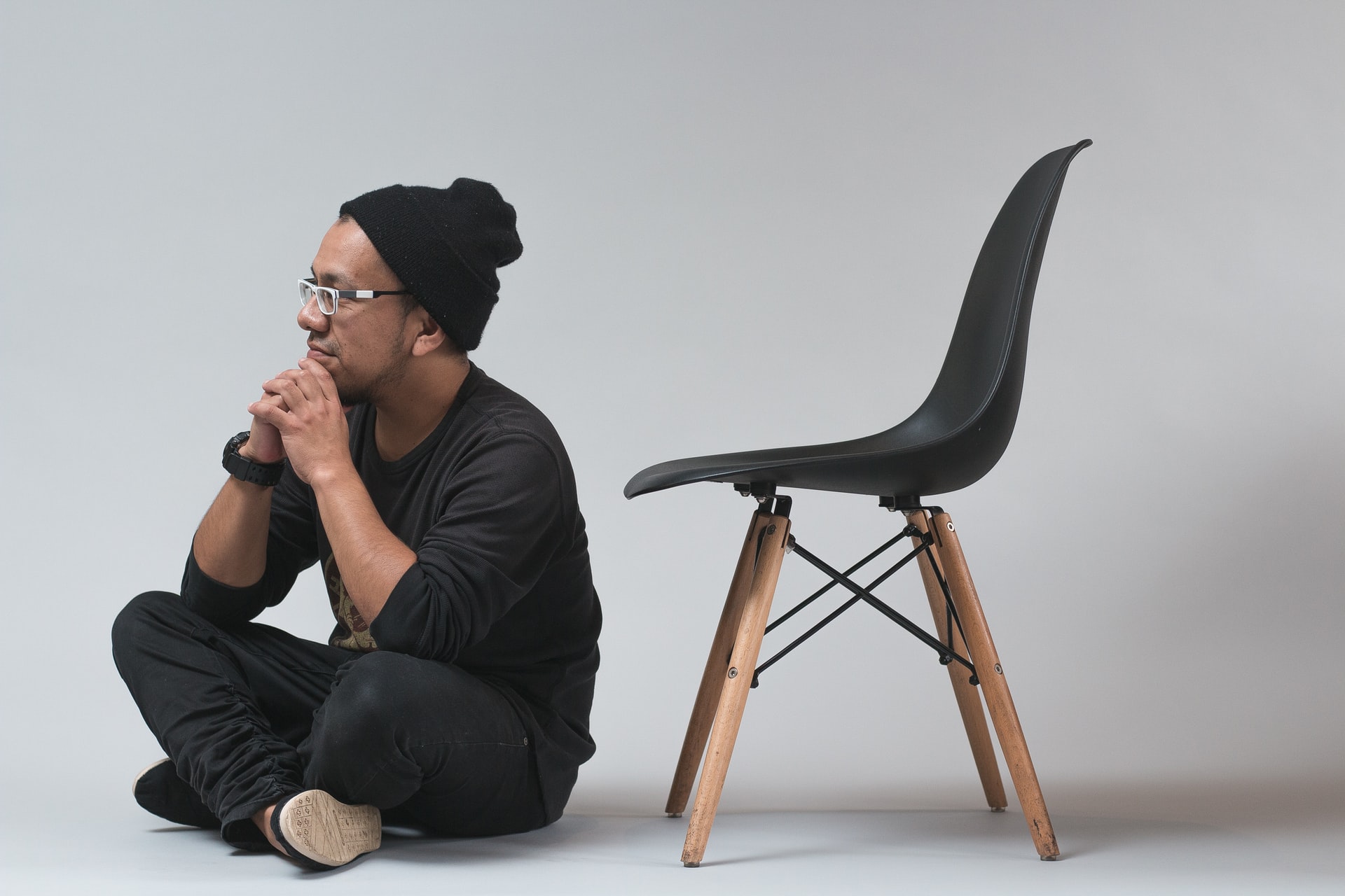 man sitting on the floor, thinking