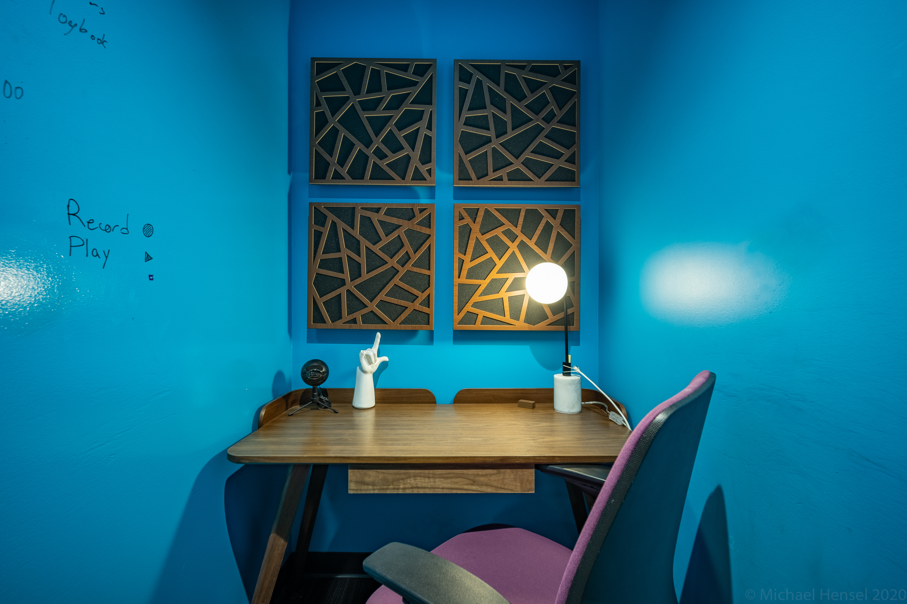 a small office with blue walls