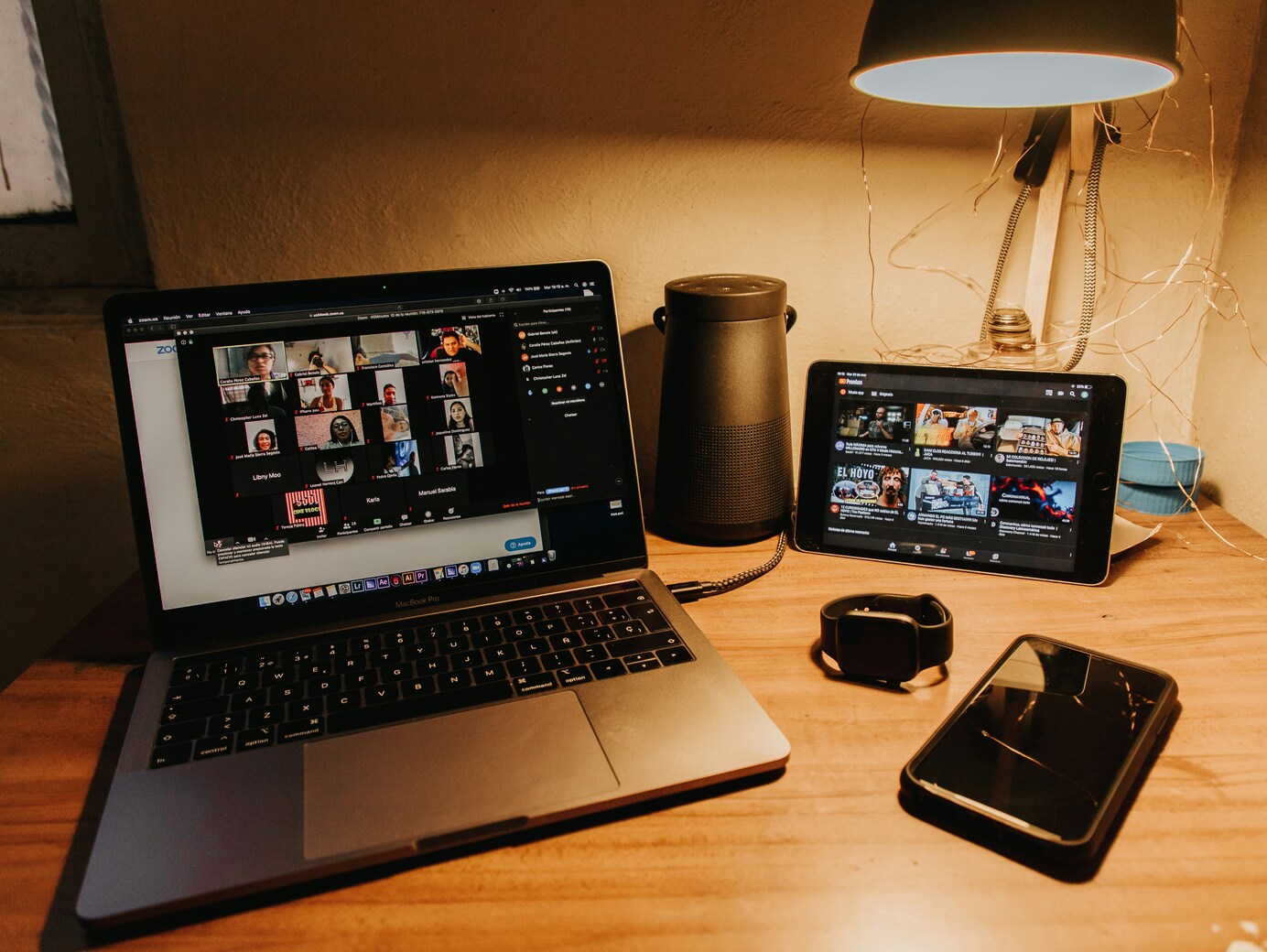 laptop, tablet, smartphone and smartwatch on table