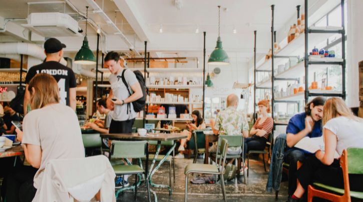 Lots of people in a busy coworking office canteen