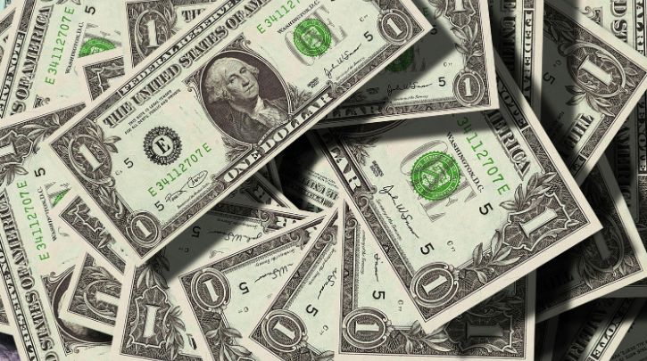 a close-up photo of a pile of American dollars